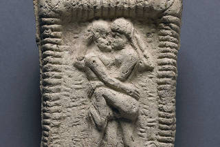 A Babylonian clay tablet of a nude couple embracing on a bed, circa 1800 B.C. According to a new study, intimate kissing is 1,000 years older and was far more widespread than previously thought. (The British Museum via The New York Times)