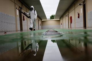 Health workers prevent the spread of mosquitos during dengue outbreak in Brasilia