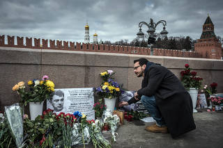 A memorial for the opposition figure Boris Nemtsov at the site where he was killed, outside the Kremlin in Moscow, on Feb. 27, 2022, the seventh anniversary of his assassination. (Sergey Ponomarev/The New York Times)