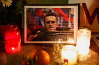 People attend a vigil following the death of Russian opposition leader Alexei Navalny, in Paris