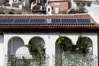 Solar panels are seen on the roof of a home in Ronda