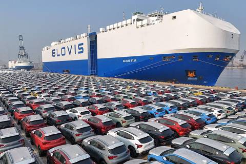 (FILES) This file photo taken on January 2, 2024 shows cars waiting to be loaded onto a ship for export at the port in Yantai, in Chinas eastern Shandong province . China overtook Japan as the world's biggest vehicle exporter last year, data from the Japan Automobile Manufacturers Association (JAMA) showed on January 31, 2024. (Photo by AFP) / China OUT