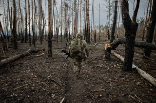 A Ukrainian Army soldier in a forest near Russian lines in Ukraine, Feb. 7, 2024. (Tyler Hicks/The New York Times)