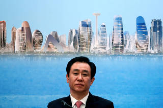 FILE PHOTO: China Evergrande Group Chairman Hui Ka Yan attends a news conference on the property developer's annual results in Hong Kong