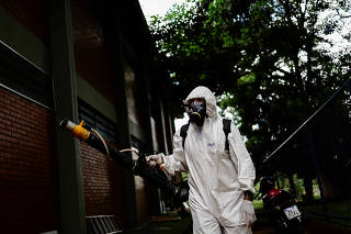 Health workers prevent the spread of mosquito during dengue outbreak, in Brasilia