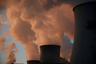 FILE PHOTO: Smoke and steam billow from Belchatow Power Station, Europe's largest coal-fired power plant, in Rogowiec, Poland