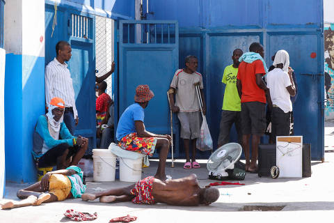 Inmates rest on the floor at the National Penitentiary following violent clashes in the capital that have damaged communications and led to a prison escape from this main penitentiary in Port-au-Prince, Haiti March 3, 2024. REUTERS/Ralph Tedy Erol ORG XMIT: GGG5