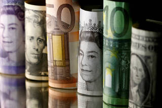 FILE PHOTO: Dollar, Euro and Pound banknotes are seen in this picture illustration
