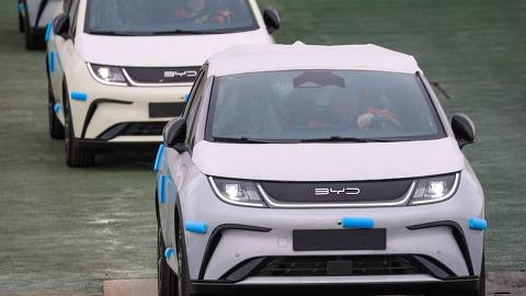 Electric vehicles of Chinese car manufacturer BYD leave the car carrier ship BYD Explorer No. 1 which is moored at the automotive terminal of operator BLG at the port of Bremerhaven, Germany, on February 26, 2024. The vessel is chartered by BYD and delivers about 3,000 BYD cars to Bremerhaven during its maiden call at Germanys most important port for cars. (Photo by FOCKE STRANGMANN / AFP)
