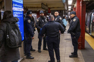 NYPD officers in a subway station in New York, on Jan. 17, 2024. (Dakota Santiago/The New York Times)