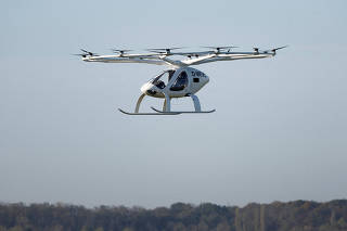 FILE PHOTO: A Volocopter 2X drone taxi performs an integrated flight in conventional air traffic