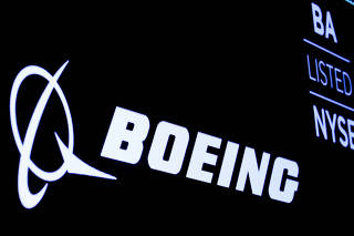 FILE PHOTO: FILE PHOTO: The Boeing logo is displayed on a screen at the NYSE in New York