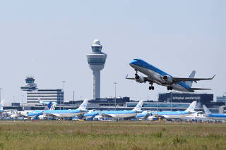 FILE PHOTO: An airplane takes off from Schiphol Airport in Amsterdam