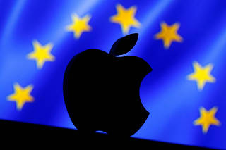 FILE PHOTO: A 3D printed Apple logo is seen in front of a displayed European Union flag in this illustration