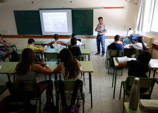 Marcel Vivet gives class in a school in Santa Eulalia de Roncana