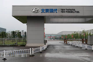 FILE PHOTO: Beijing Hyundai sign is seen at an entrance to the Beijing Hyundai Motor plant in Chongqing