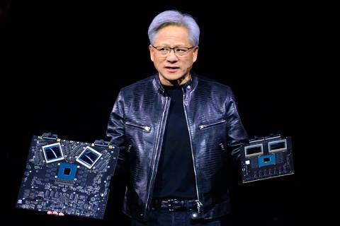 NVIDIA's CEO Jensen Huang displays products on-stage during the annual Nvidia GTC Artificial Intelligence Conference at SAP Center in San Jose, California, on March 18, 2024. (Photo by JOSH EDELSON / AFP)
