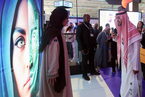 A visitor communicates with Saudi Arabia's first robot 