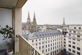 A view of the Eiffel Tower from an apartment in the Îlot Saint-Germain public housing development in Paris, on Feb. 8, 2024. (Alex Cretey-Systermans/The New York Times)