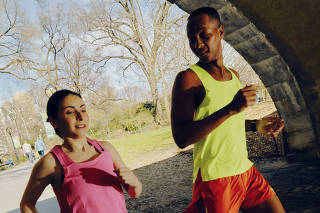 Amy Gruenhut, left, trains with Nick Arrington in Central Park in New York, March 14, 2024. (Peter Garritano/The New York Times)
