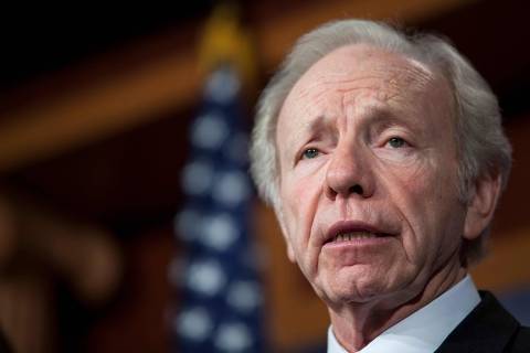 US Senator Joe Lieberman (I-CT) speaks during a press conference about their report on the Benghazi consulate attack, on Capitol Hill, on December 31, 2012 in Washington, DC. Lieberman, who made history as the first Jewish vice presidential candidate for a major US party and lately returned to the spotlight as a leader of a push for a third candidate in the 2024 election, died on March 27, 2024, US media reports said. (Photo by Drew ANGERER / GETTY IMAGES NORTH AMERICA / AFP)