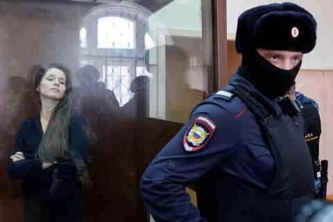Journalist Antonina Favorskaya, who is charged with participation in an extremist organization, stands inside an enclosure for defendants in a courtroom in Moscow, Russia, March 29, 2024. Favorskaya was detained on March 27 and accused of participating in the Anti-Corruption Foundation, which late opposition leader Alexei Navalny founded, according to a support group for Favorskaya. REUTERS/Yulia Morozova ORG XMIT: AAA