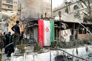 Smoke rises after what the Iranian media said was an Israeli strike on a building close to the Iranian embassy in Damascus