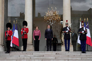 British Grenadiers join Republican Guards for Elysee changing of the guard in Paris