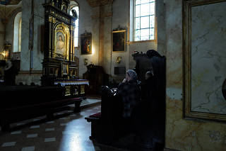 People pray at the Basilica of the Presentation of the Blessed Virgin Mary in Wadowice