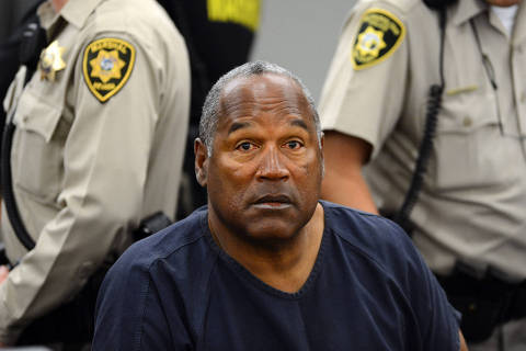 (FILES) O.J. Simpson appears during a break in an evidentiary hearing in Clark County District Court on May 14, 2013 in Las Vegas, Nevada. Simpson, who is currently serving a nine-to-33-year sentence in state prison as a result of his October 2008 conviction for armed robbery and kidnapping charges, is using a writ of habeas corpus to seek a new trial, claiming he had such bad representation that his conviction should be reversed. Simpson has died at the age of 76, his family said on April 11, 2024. (Photo by Ethan Miller / POOL / AFP)
