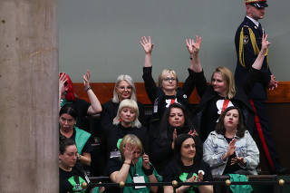 Women Rights activists react after voting on sending four bills on the liberalisation of abortion laws to be analysed by a special commission, at the parliament in Warsaw