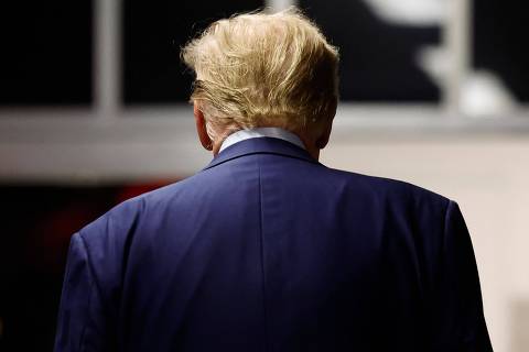 NEW YORK, NEW YORK - APRIL 16: Former President Donald Trump walks towards the courtroom for the second day of his criminal trial at Manhattan Criminal Court on April 16, 2024 in New York City. Jury selection continues in the criminal trial of the former president, who faces 34 felony counts of falsifying business records in the first of his criminal cases to go to trial. This is the first-ever criminal trial against a former president of the United States.   Michael M. Santiago/Getty Images/AFP (Photo by Michael M. Santiago / GETTY IMAGES NORTH AMERICA / Getty Images via AFP)