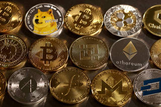FILE PHOTO: FILE PHOTO: Illustration shows representations of cryptocurrencies