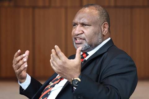 Papua New Guineas Prime Minister James Marape reacts as he speaks during an interview in Sydney on December 11, 2023. (Photo by DAVID GRAY / AFP) ORG XMIT: DBG200