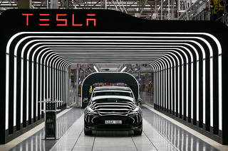 FILE PHOTO: Tesla hands over first cars produced at new plant in Gruenheide