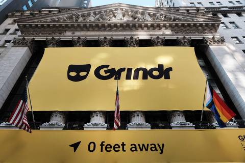 NEW YORK, NEW YORK - NOVEMBER 18: The LGBTQ social networking platform Grindr displays its banner outside of the New York Stock Exchange (NYSE) as the company goes public following its merger with special purpose acquisition company (SPAC) Tiga Acquisition Corp. on November 18, 2022 in New York City. Trading under the ticker symbol 