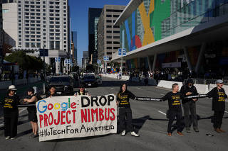 Protesters rally outside the Google Cloud Next Conference