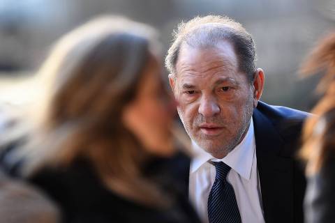 (FILES) Harvey Weinstein arrives to the Manhattan Criminal Court, on February 21, 2020, in New York City. New York's highest court on April 25, 2024, overturned Hollywood producer Weinstein's 2020 conviction on sex crime charges and ordered a new trial. In their decision, judges cited errors in the way the trial had been conducted, including admitting the testimony of women who were not part of the charges against him. 