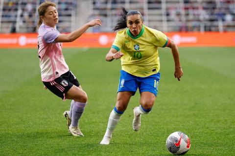 Brazil's forward #10 Marta chases the ball covered by Japan's defender #12 Rion Ishikawa during the SheBelieves Cup football match for 3rd place between Brazil and Japan at Lower.com Field in Columbus, Ohio, April 9, 2024. (Photo by Graham Stokes / AFP)