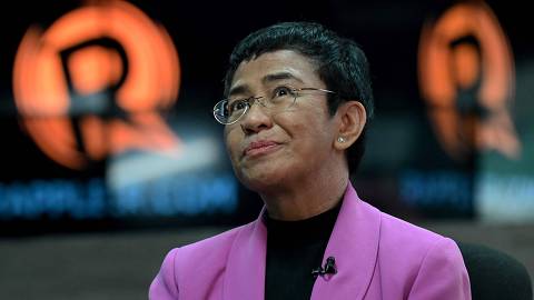(FILES) This file photo taken on January 18, 2023 shows Nobel Laureate Maria Ressa talking during an interview with AFP at Rappler offices in Pasig, Metro Manila. A foreign ownership case against Philippine Nobel laureate Maria Ressa has been dropped, her media outlet said on December 13, 2023, but the journalist still faces the threat of imprisonment on other charges. (Photo by JAM STA ROSA / AFP)
