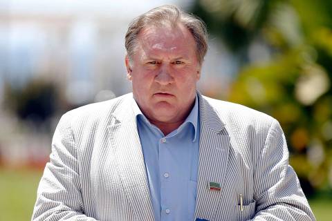 (FILES) French actor and newly-minted Russian citizen Gerard Depardieu poses on June 6, 2013 after holding a press conference dedicated to the launch of the first Russian film festival in Nice, in southeastern France. French police summoned Depardieu over suspected sexual assault, a police source said on April 29, 2024. Depardieu already faces a rape charge and sexual assault investigation, as well as claims of assault by more than a dozen women -- all of which he has strongly denied. (Photo by Valery HACHE / AFP) ORG XMIT: VH1145