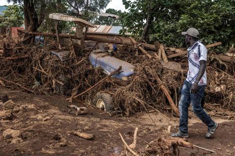 A man walks next to a damaged tractor carried by waters in an area heavily affected by torrential rains and flash floods in the village of Kamuchiri, near Mai Mahiu, on April 29, 2024. At least 45 people died when a dam burst its banks near a town in Kenya's Rift Valley, police said on April 29, 2024, as torrential rains and floods battered the country.
The disaster raises the total death toll over the March-May wet season in Kenya to more than 120 as heavier than usual rainfall pounds East Africa, compounded by the El Nino weather pattern. (Photo by LUIS TATO / AFP)