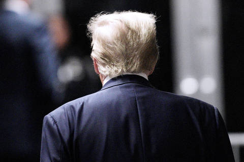 Former U.S. President Donald Trump walks at New York State Supreme Court in New York, New York, U.S., 30 April 2024. Trump is facing 34 felony counts of falsifying business records related to payments made to adult film star Stormy Daniels during his 2016 presidential campaign.     Curtis Means/Pool via REUTERS ORG XMIT: GPD