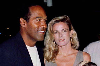 FILE PHOTO: FILE PHOTO OF O.J. SIMPSON POSING WITH CHILDREN AND EX WIFE NICOLE.