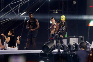 A singer, believed to be Madonna, rehearses ahead of a concert at Copacabana beach, in Rio de Janeiro