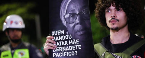 A demonstrator holds a sign that reads 'Who ordered to kill Mae Bernadete Pacifico' during a march against police violence towards the Black community and for Mae Bernadete Pacifico, a Black community activist who was killed in Bahia on August 17th, in Sao Paulo, Brazil August 24, 2023. REUTERS/Carla Carniel ORG XMIT: LIVE
