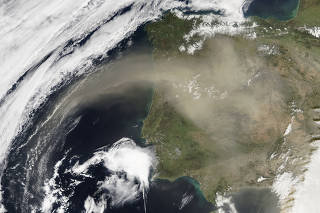 In a satellite image provided by NASA/Goddard/Jeff Schmaltz/MODIS Land Rapid Response Team, Saharan dust over the Iberian Peninsula, captured in a photo from the Aqua satellite in 2016. (NASA/Goddard/Jeff Schmaltz/MODIS Land Rapid Response Team via The New York Times)