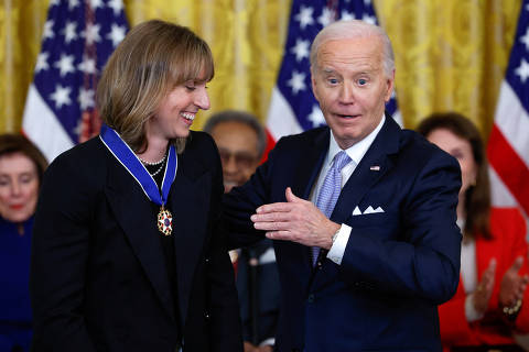 U.S. President Joe Biden presents the Presidential Medal of Freedom to Olympic swimmer Katie Ledecky during a ceremony at the White House in Washington, U.S., May 3, 2024. REUTERS/Evelyn Hockstein ORG XMIT: LIVE