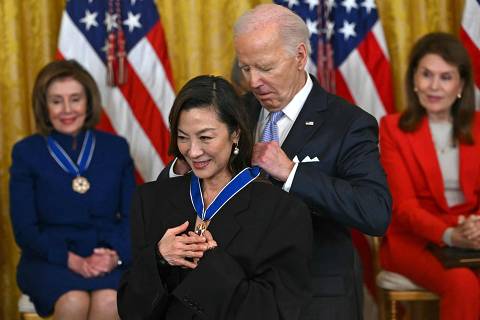 TOPSHOT - US President Joe Biden presents the Presidential Medal of Freedom to Malaysian actress Michelle Yeoh in the East Room of the White House in Washington, DC, on May 3, 2024. The Presidential Medal of Freedom is the Nation's highest civilian honor, presented to individuals who have made exemplary contributions to the prosperity, values, or security of the United States, world peace, or other significant societal, public or private endeavors. (Photo by ANDREW CABALLERO-REYNOLDS / AFP)