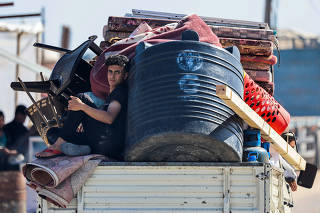 Palestinians flee Rafah after Israeli forces launched a ground and air operation in the eastern part of the city